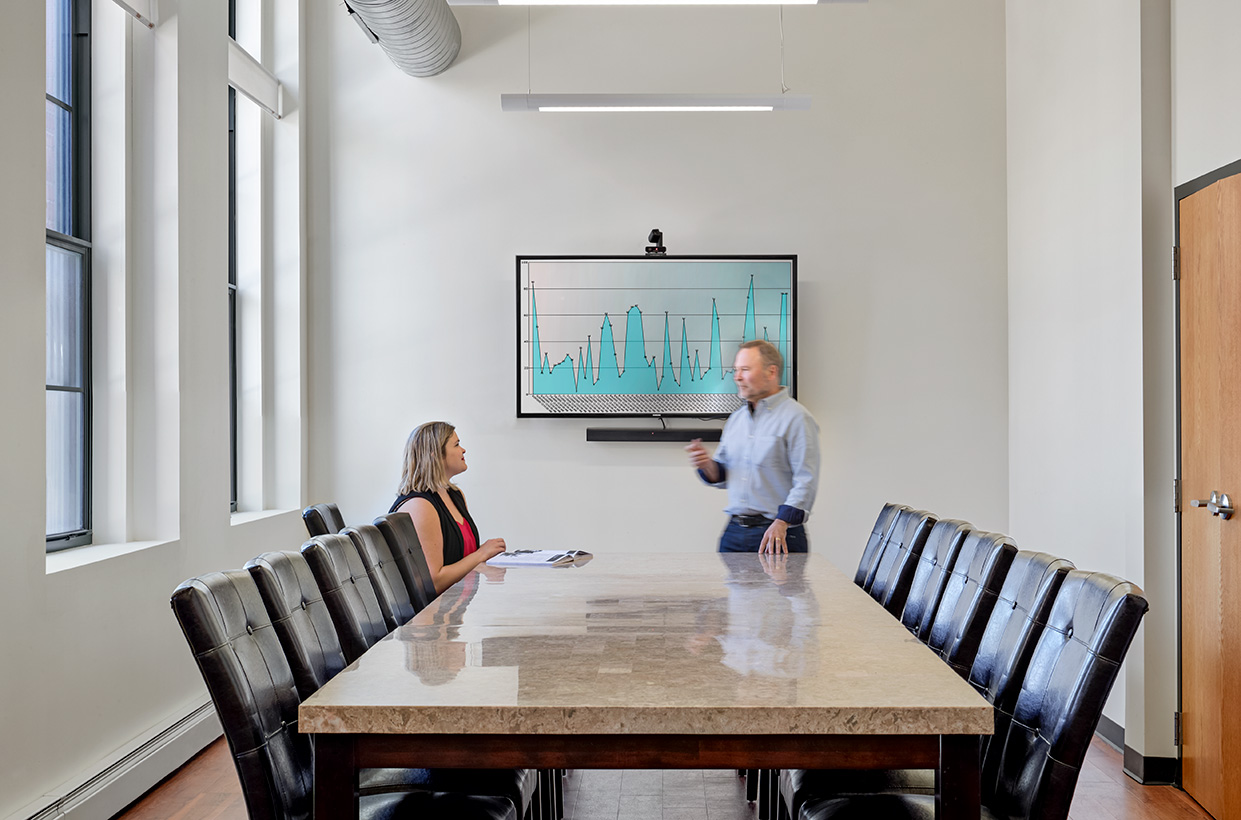 Two people inside conference room