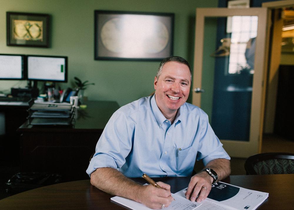 Kent at his desk