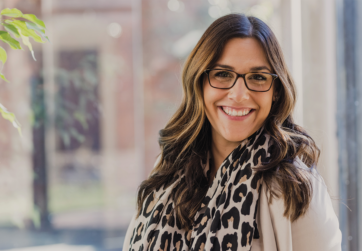 Portrait of Alyssa smiling in her office