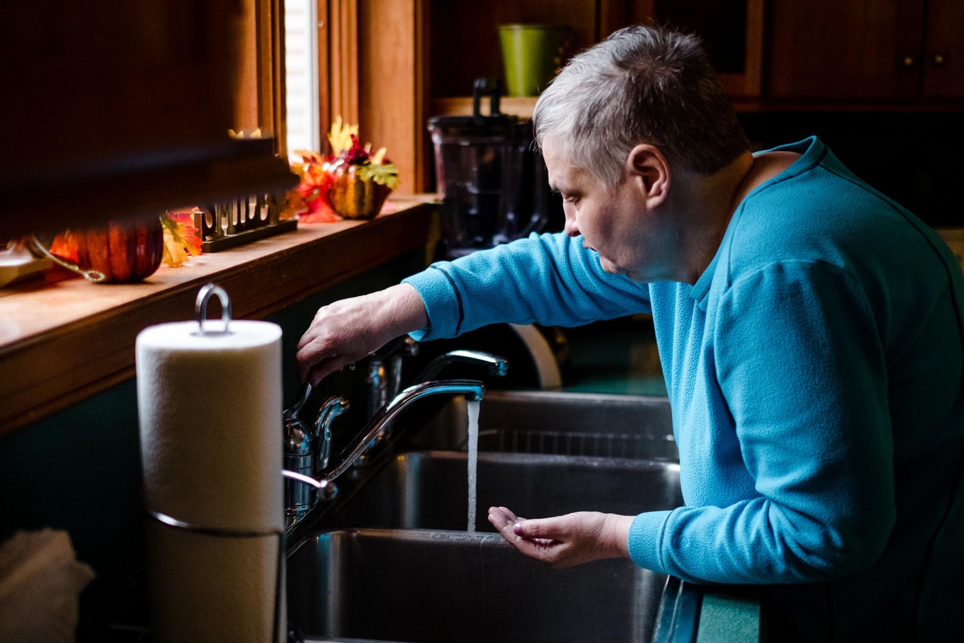 Image of person washing their hands