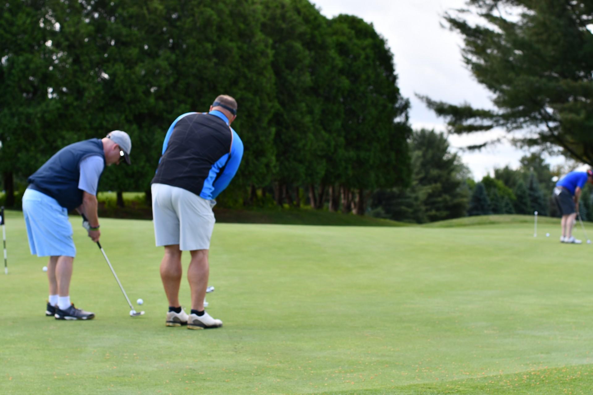 Two men golfing