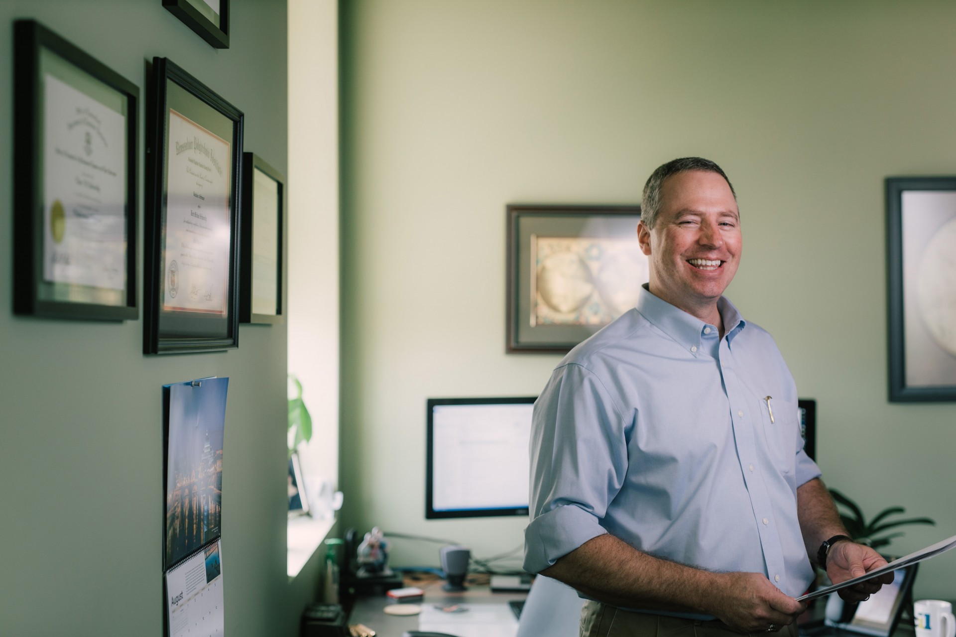 Kent standing in his office