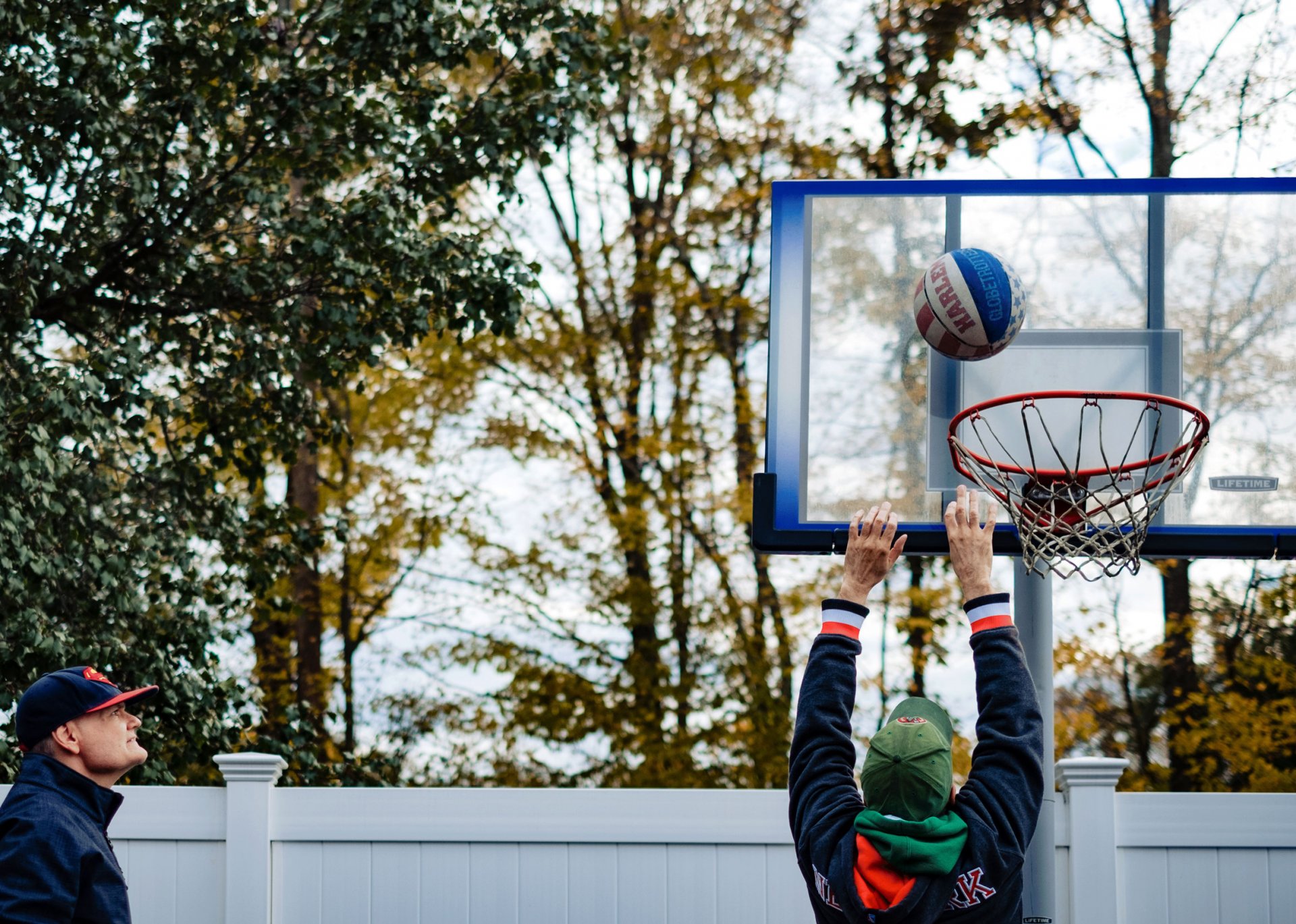 Two men playing basketball